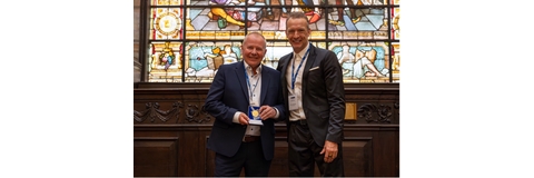 Tim Gray receiving the Industry Gold Medal from Richard Whitehead, MBE